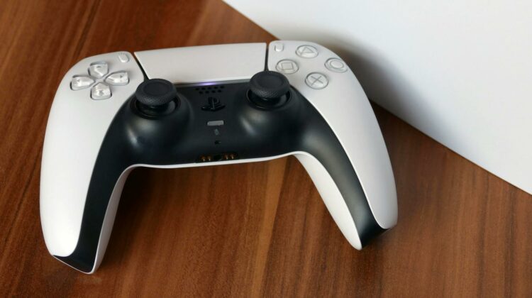 a white controller sitting on top of a white box